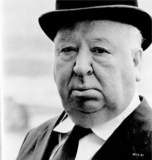 Alfred Hitchcock in a suit and bowler hat.
