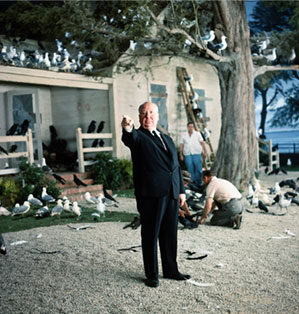Alfred Hitchcock directing on the set of The Birds.